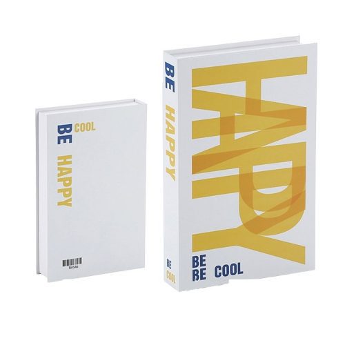 Deux livres à couverture blanche constituent un accessoire de lecture élégant. Le plus grand porte la mention "HAPPY" en jaune gras et "BE COOL" dans le coin, tandis que le plus petit affiche "BE HAPPY" et "COOL" en bleu et jaune.
